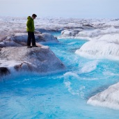 Greenland ice sheet melt in action: observing surface runoff in a stunning supraglacial stream (ph. Sara Penrhyn-Jones)